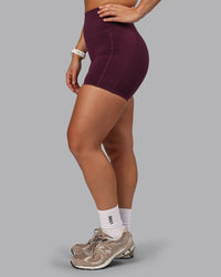 Woman wearing Elixir Ultra High-Rise 6" Short Pockets - Cherry Lacquer
