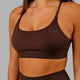 Woman wearing Elixir Sports Bra - Chocolate
