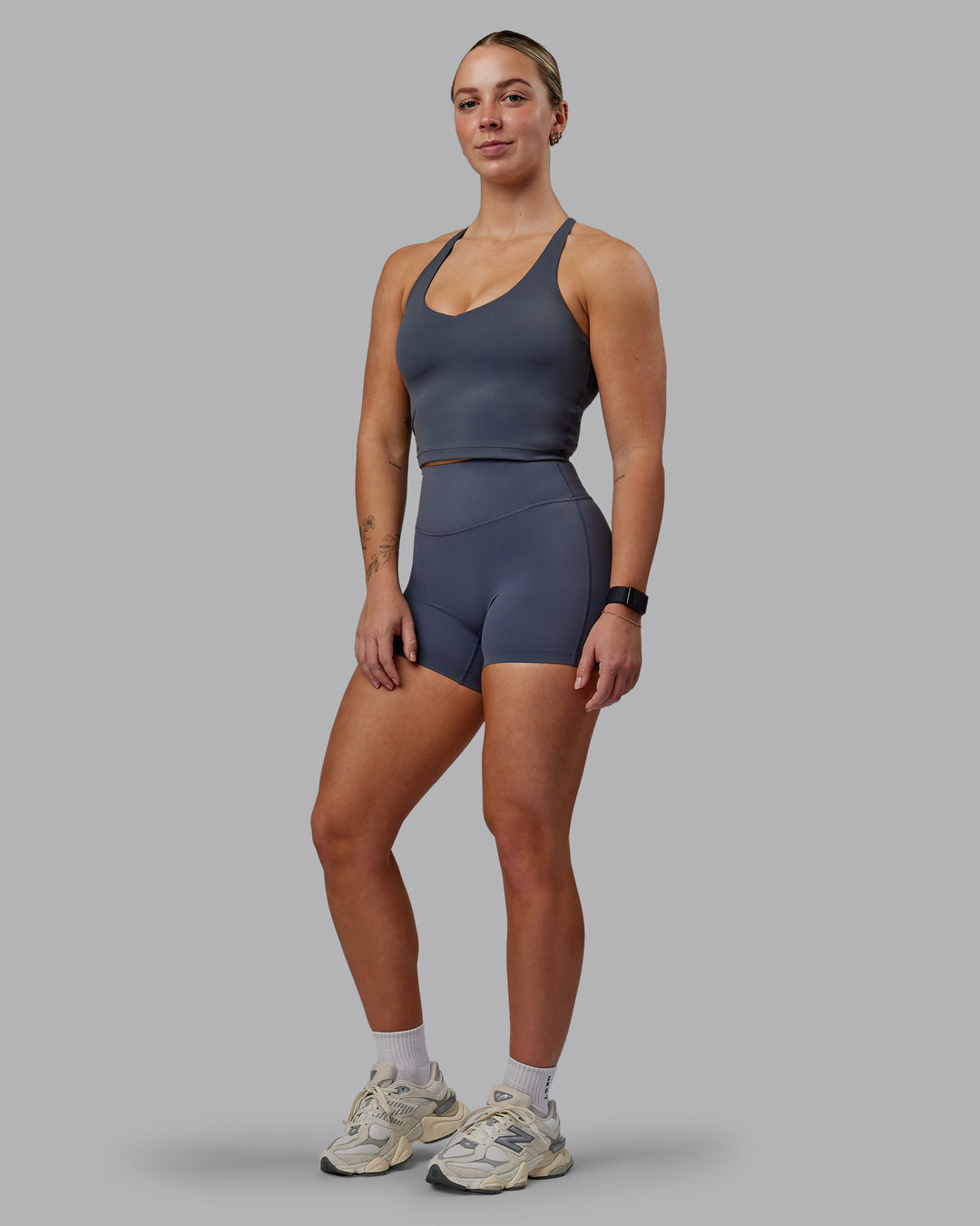 Woman wearing Elixir Ultra High-Rise 4" Short - Turbulence | Model:Suz | Size:S