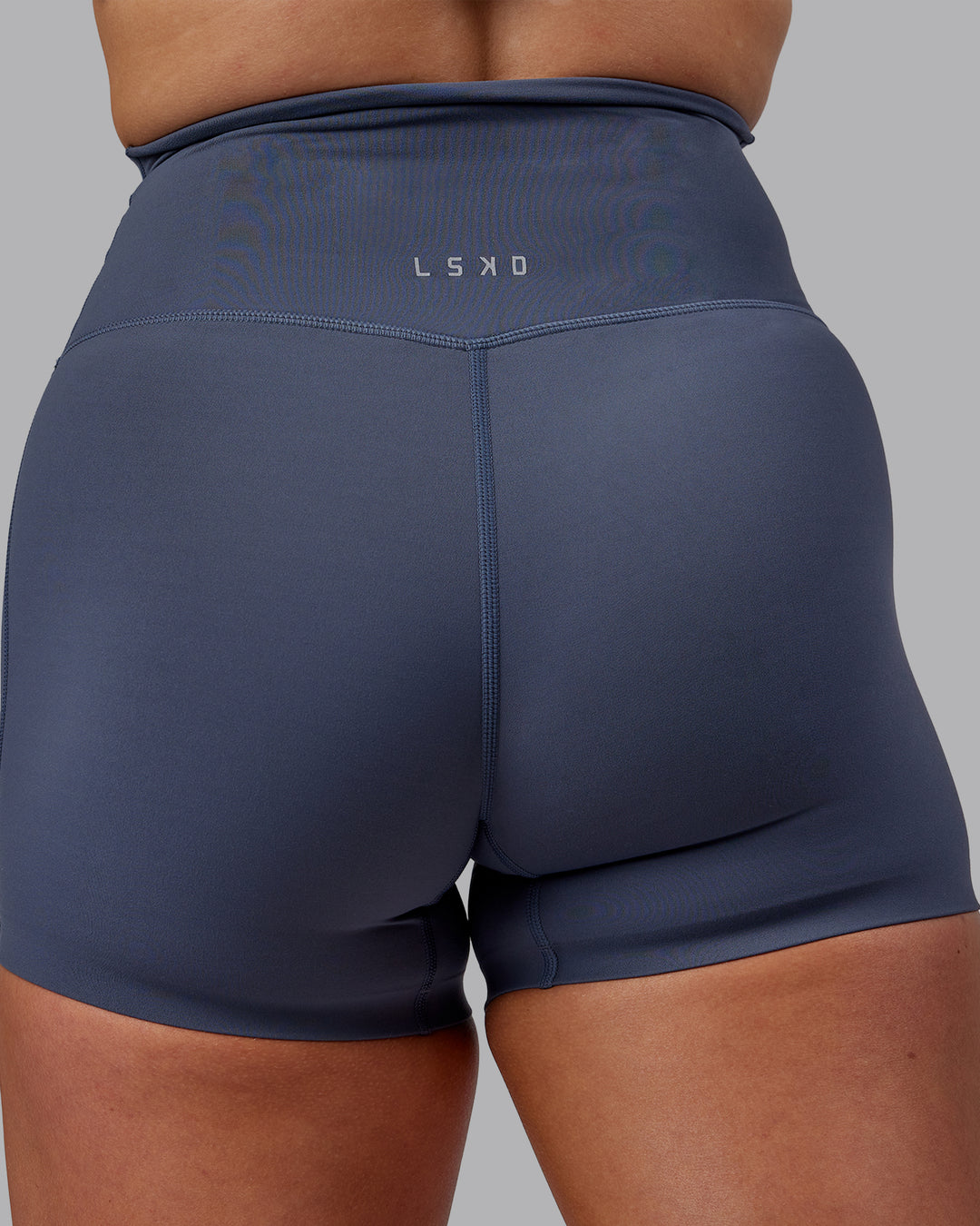 Woman wearing Elixir Ultra High-Rise 4&quot; Short - Turbulence | Model:Suz | Size:S