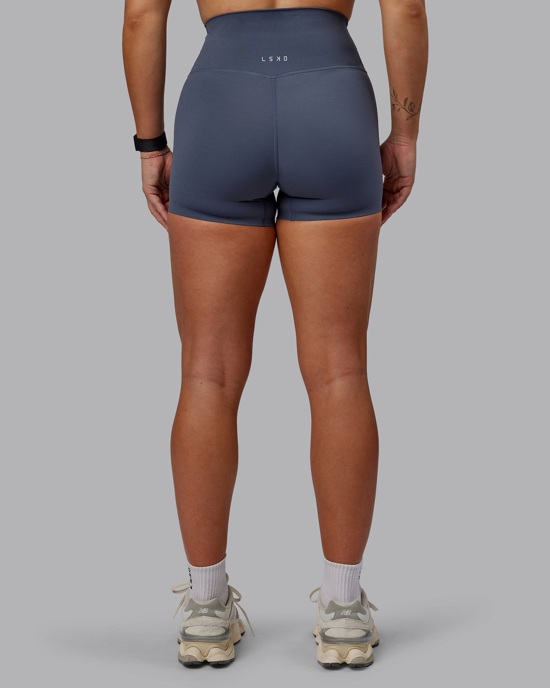 Woman wearing Elixir Ultra High-Rise 4&quot; Short - Turbulence | Model:Suz | Size:S