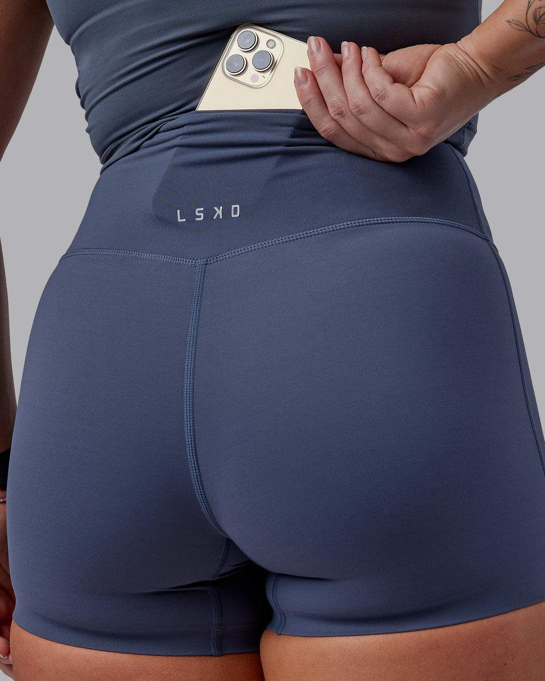 Woman wearing Elixir Ultra High-Rise 4&quot; Short - Turbulence | Model:Suz | Size:S