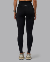 Woman wearing Elixir Ultra High-Rise Tall Legging Pockets - Black