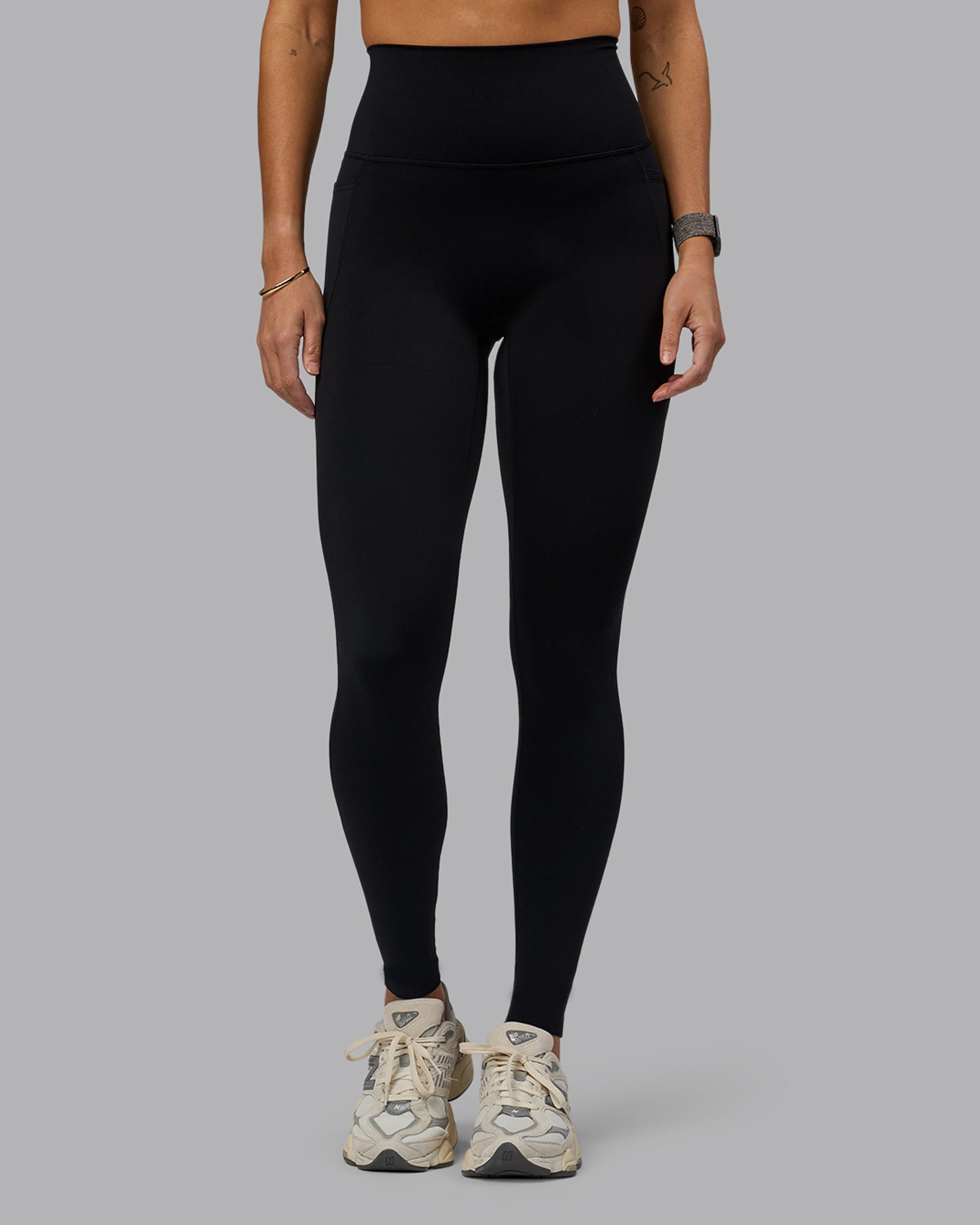 Woman wearing Elixir Ultra High-Rise Tall Legging Pockets - Black