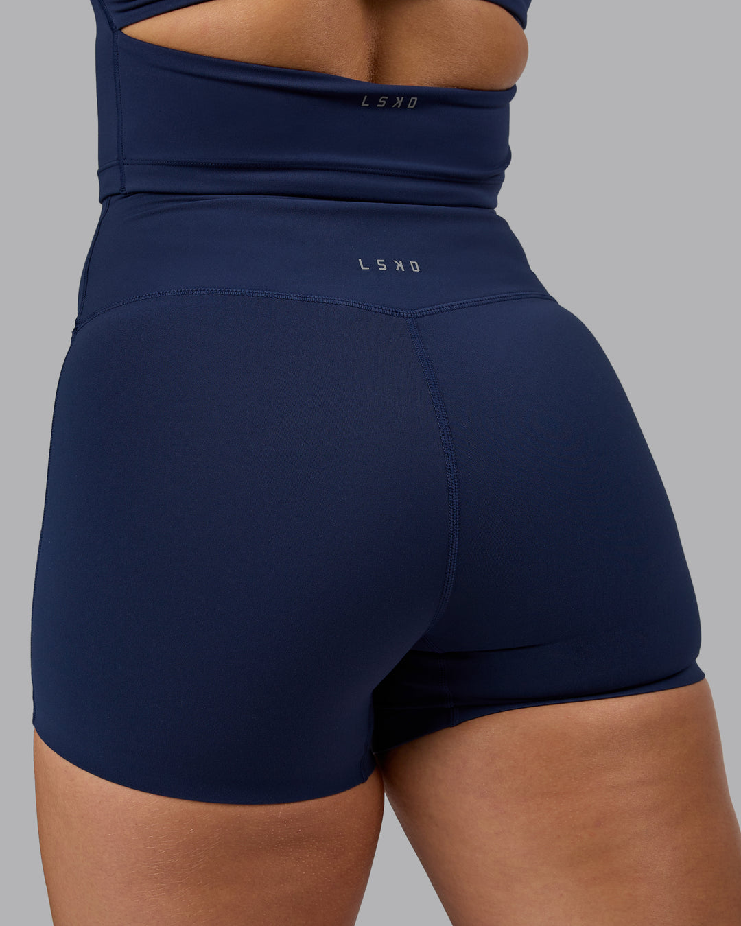 Woman wearing Elixir Ultra High-Rise 4&quot; Short - Future Navy | Model:Lyss | Size:S
