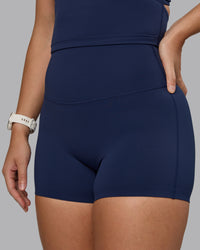 Woman wearing Elixir Ultra High-Rise 4" Short - Future Navy | Model:Lyss | Size:S