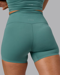 Woman wearing Elixir Ultra High-Rise 4" Short - Sagebrush | Model:Sophie | Size:S