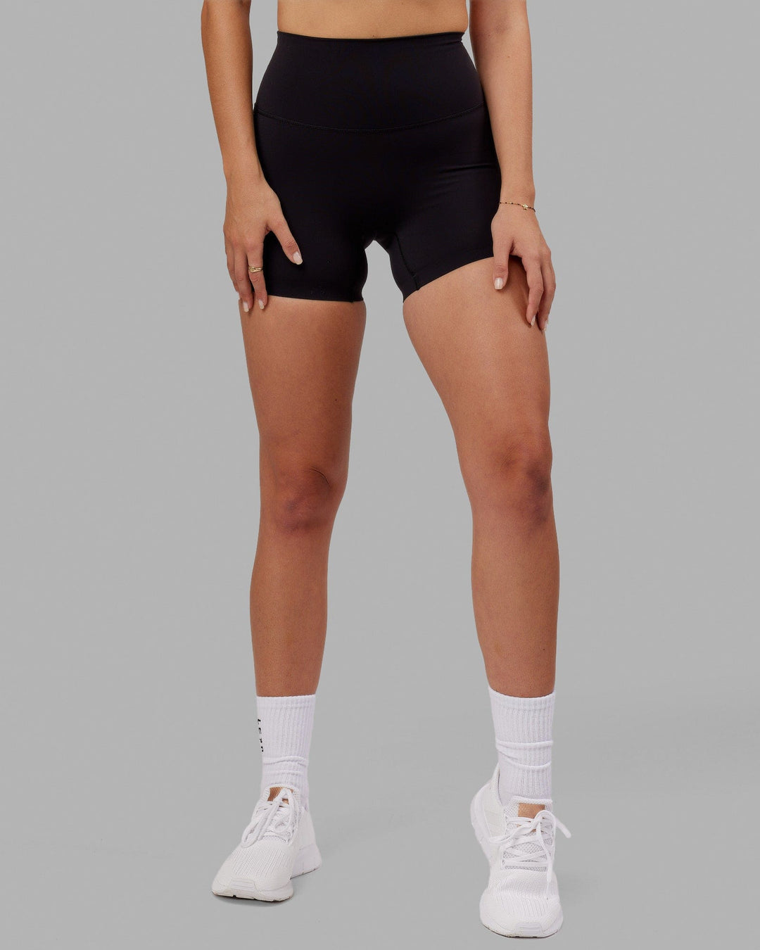 Woman wearing Elixir Ultra High-Rise 4&quot; Short - Black | Model:Chelsea | Size:S