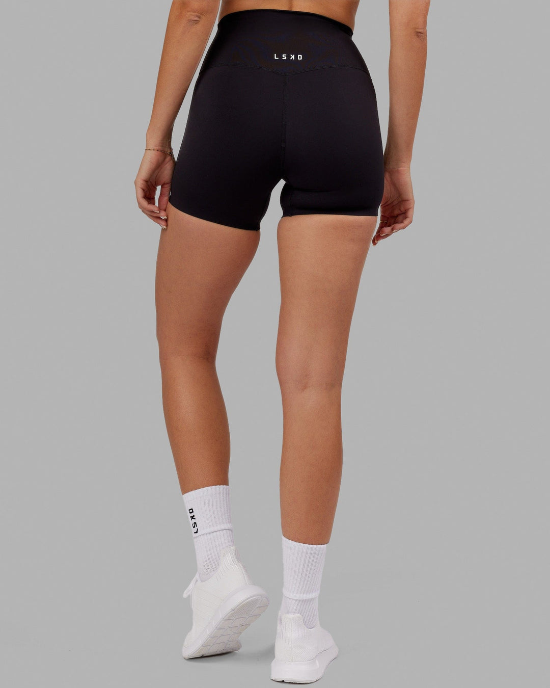 Woman wearing Elixir Ultra High-Rise 4&quot; Short - Black | Model:Chelsea | Size:S