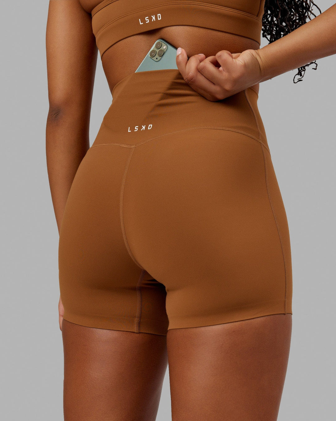 Woman wearing Elixir X-Short Tight - Camel