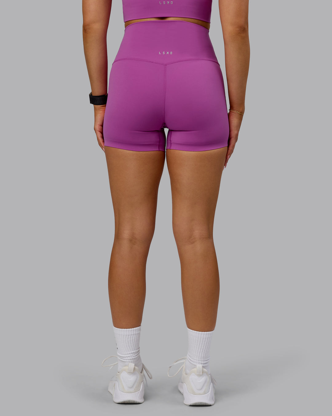 Woman wearing Elixir Ultra High-Rise 4&quot; Short - Orchid | Model:Halle | Size:S