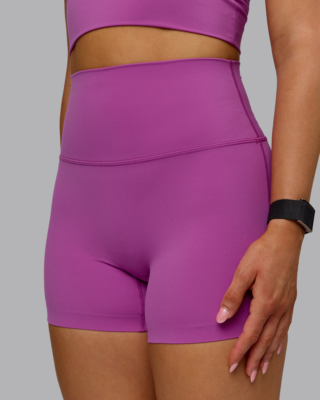 Woman wearing Elixir Ultra High-Rise 4" Short - Orchid | Model:Halle | Size:S
