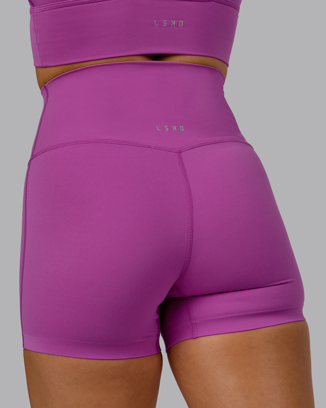 Woman wearing Elixir Ultra High-Rise 4&quot; Short - Orchid | Model:Halle | Size:S
