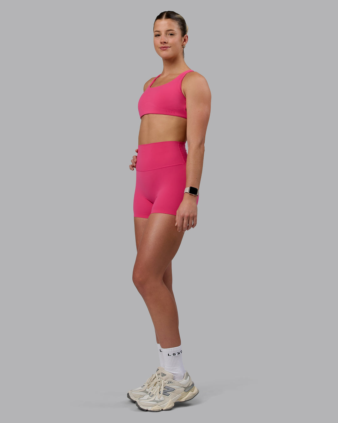 Woman wearing Elixir Ultra High-Rise 4&quot; Short - Pink Flash | Model:Chloe | Size:XS