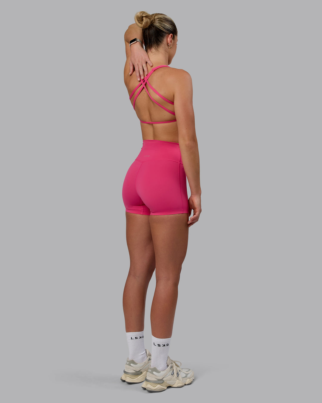 Woman wearing Elixir Ultra High-Rise 4&quot; Short - Pink Flash | Model:Chloe | Size:XS