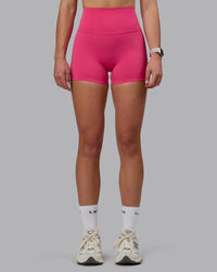Woman wearing Elixir Ultra High-Rise 4" Short - Pink Flash | Model:Chloe | Size:XS