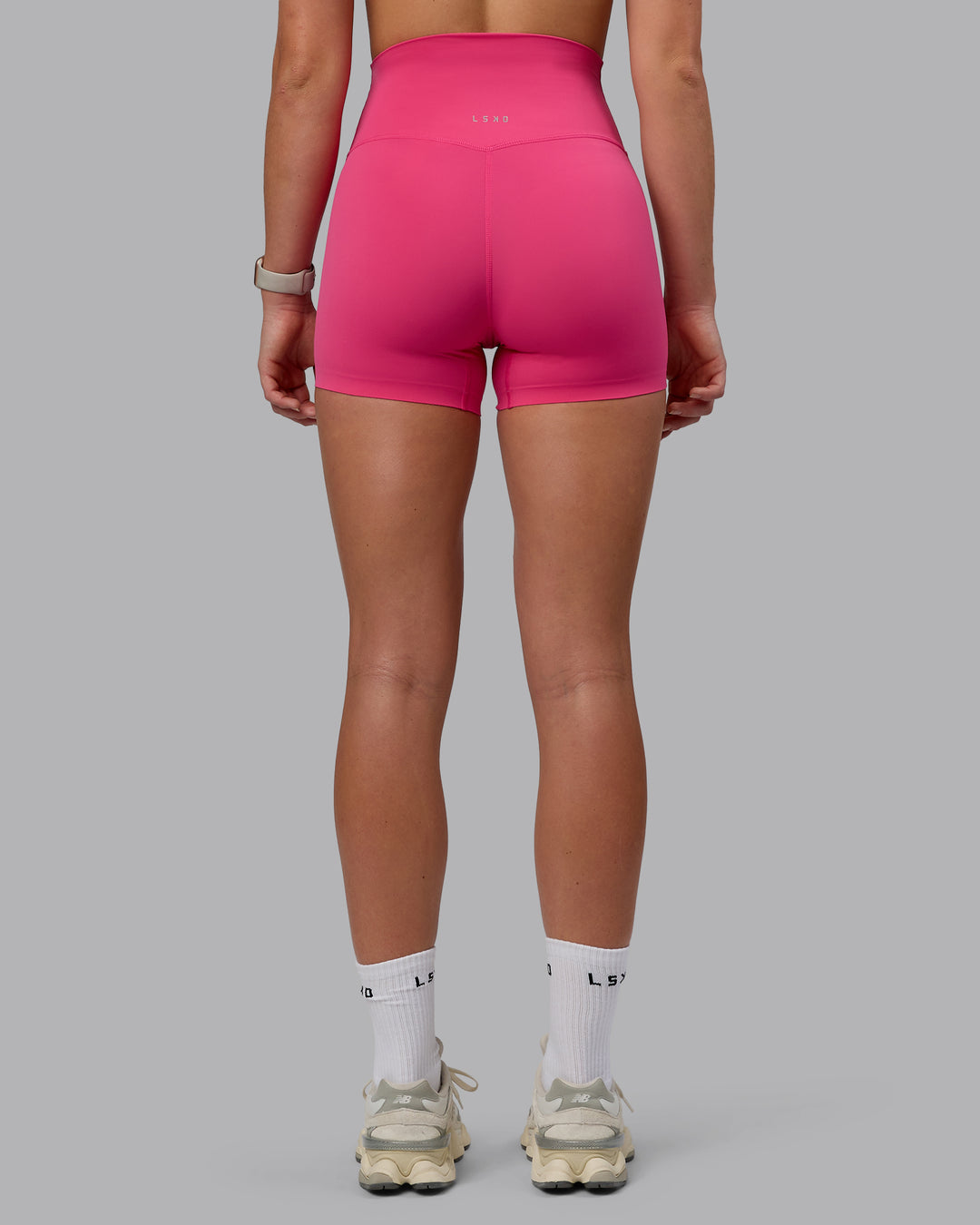 Woman wearing Elixir Ultra High-Rise 4&quot; Short - Pink Flash | Model:Chloe | Size:XS