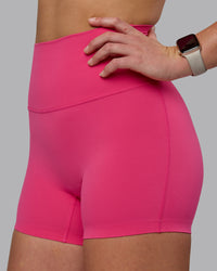 Woman wearing Elixir Ultra High-Rise 4" Short - Pink Flash | Model:Chloe | Size:XS