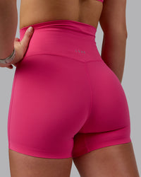 Woman wearing Elixir Ultra High-Rise 4" Short - Pink Flash | Model:Chloe | Size:XS