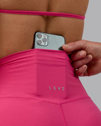 Woman wearing Elixir Ultra High-Rise 4" Short - Pink Flash | Model:Chloe | Size:XS
