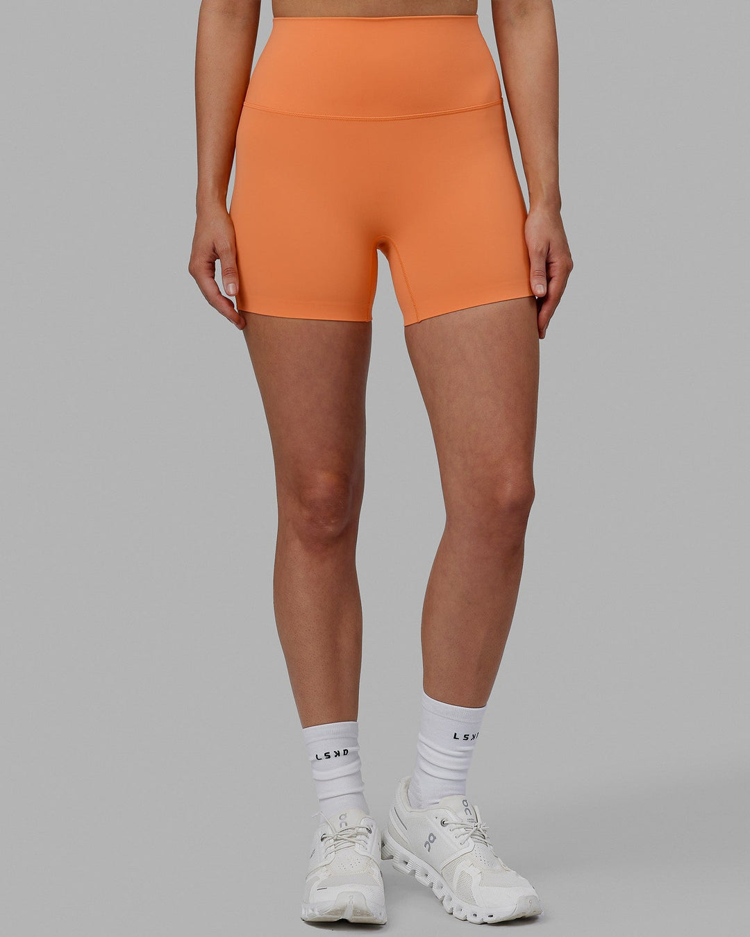 Woman wearing Elixir X-Short Tights - Tangerine