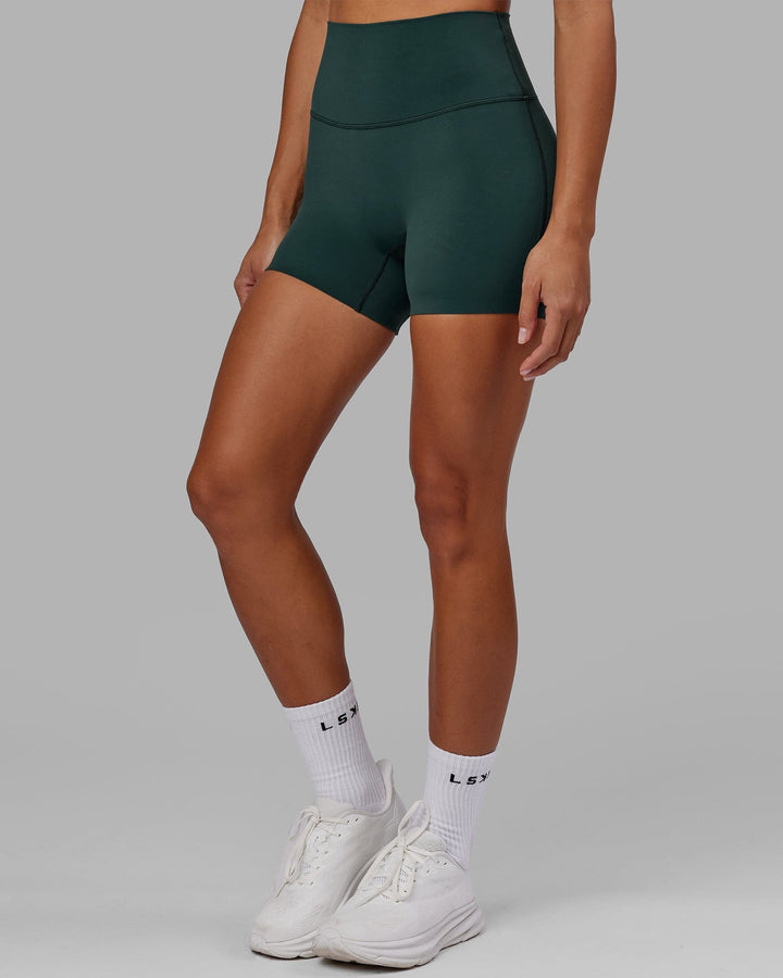 Woman wearing Elixir X-Short Tight - Vital Green