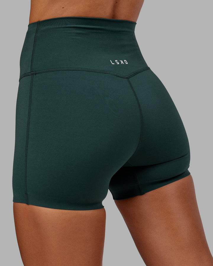 Woman wearing Elixir X-Short Tight - Vital Green