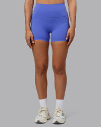 Woman wearing Elixir Ultra High-Rise 4" Short Pockets - Baja Blue | Model:Sophie | Size:S