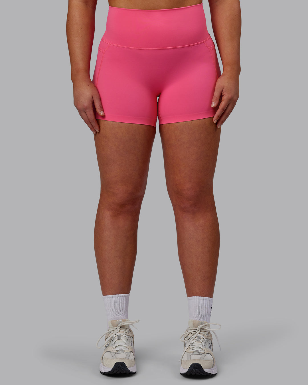 Woman wearing Elixir Ultra High-Rise 4&quot; Short Pockets - Carmine Rose | Model:Bronty | Size:M