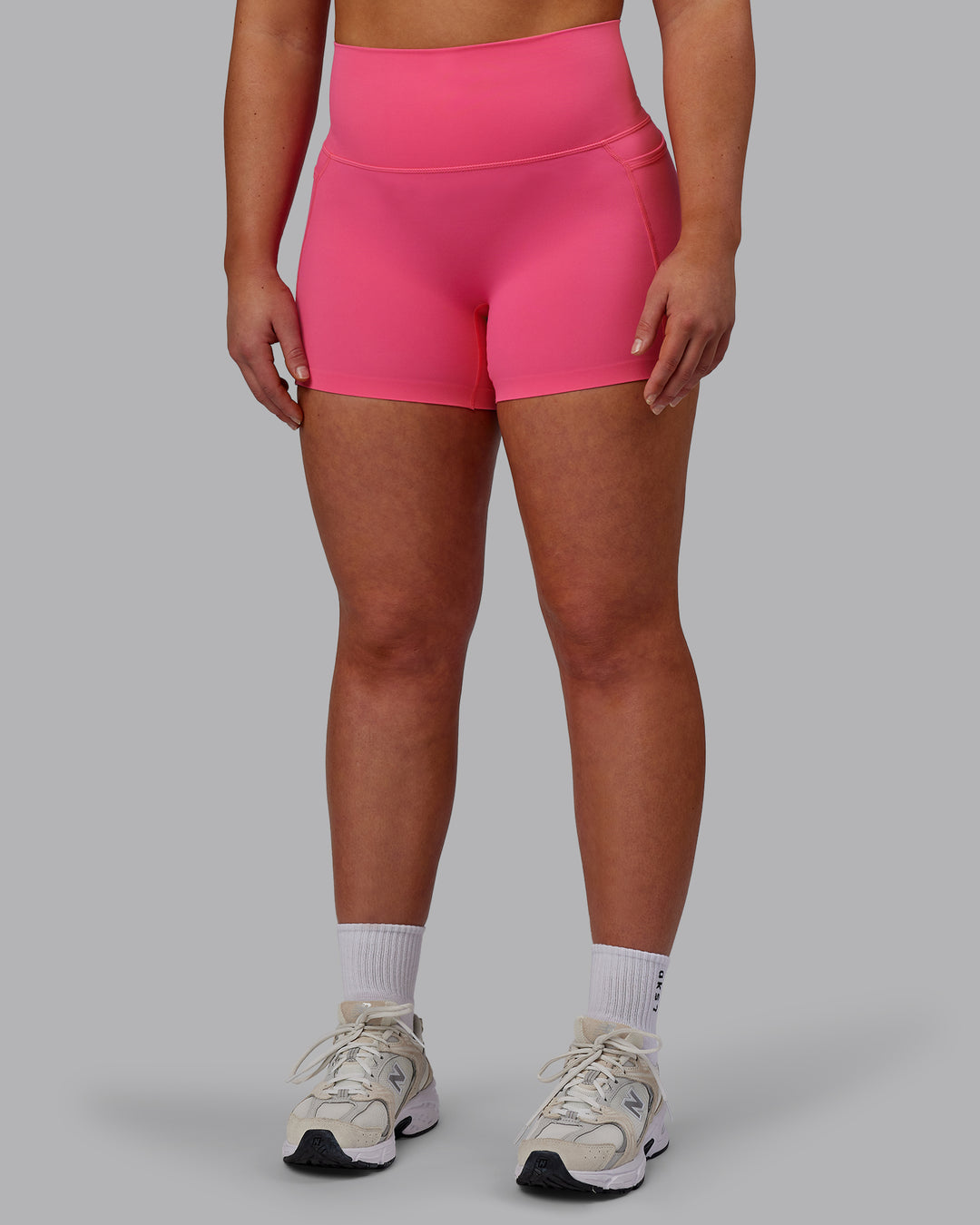 Woman wearing Elixir Ultra High-Rise 4&quot; Short Pockets - Carmine Rose | Model:Bronty | Size:M