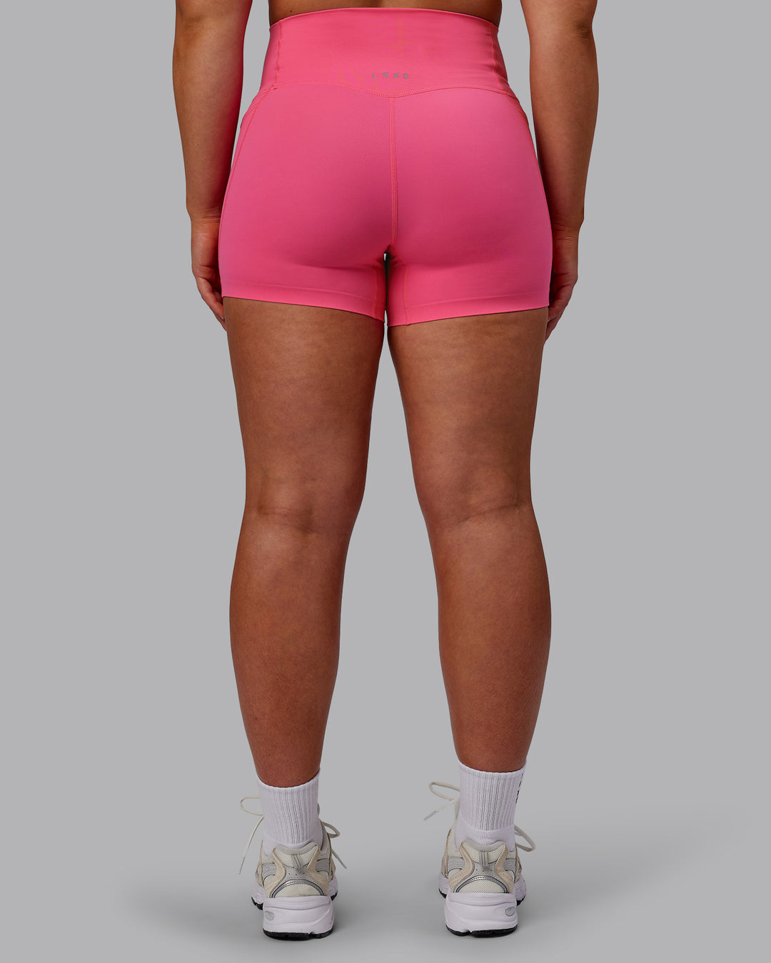 Woman wearing Elixir Ultra High-Rise 4&quot; Short Pockets - Carmine Rose | Model:Bronty | Size:M