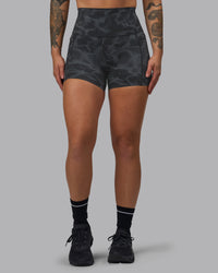 Woman wearing Elixir Ultra High-Rise 4" Short Pockets - Tranquil-Black | Model:Robyn | Size:S