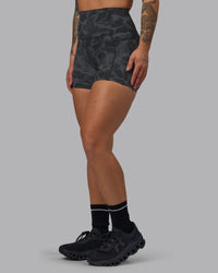 Woman wearing Elixir Ultra High-Rise 4" Short Pockets - Tranquil-Black | Model:Robyn | Size:S