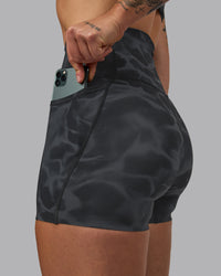 Woman wearing Elixir Ultra High-Rise 4" Short Pockets - Tranquil-Black | Model:Robyn | Size:S