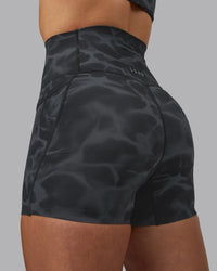 Woman wearing Elixir Ultra High-Rise 4" Short Pockets - Tranquil-Black | Model:Robyn | Size:S