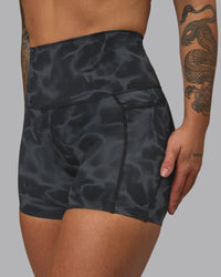 Woman wearing Elixir Ultra High-Rise 4" Short Pockets - Tranquil-Black | Model:Robyn | Size:S