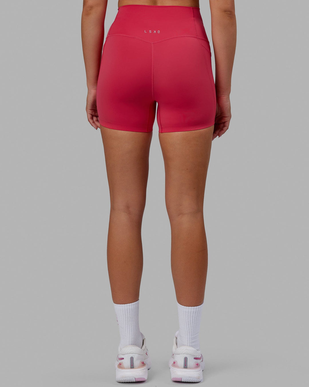 Woman wearing Elixir X-Short Tights With Pockets - Raspberry