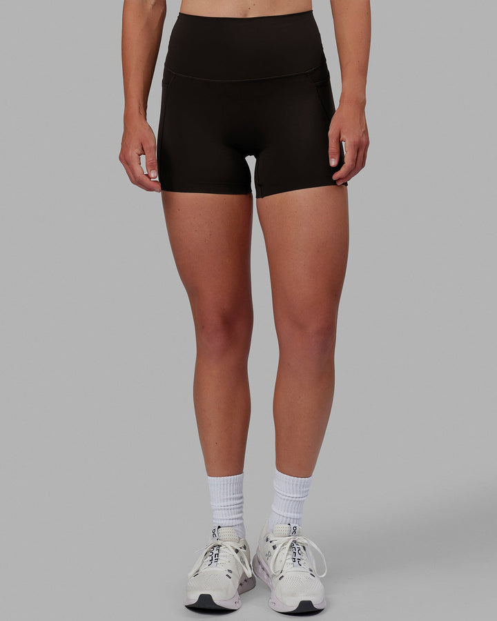 Woman wearing Elixir X-Short Tights With Pockets - Dark Walnut