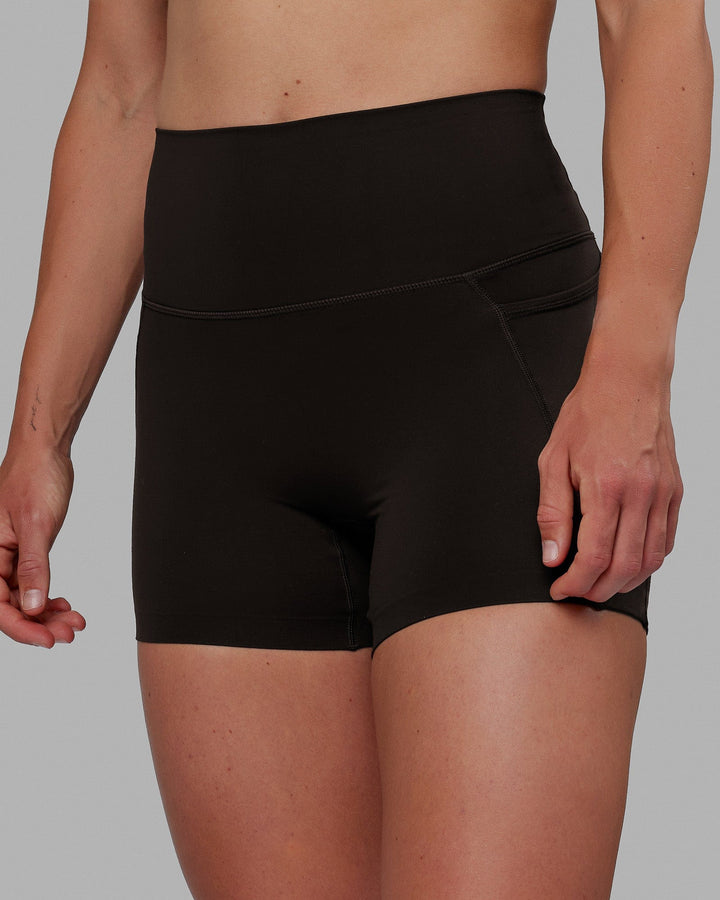 Woman wearing Elixir X-Short Tights With Pockets - Dark Walnut