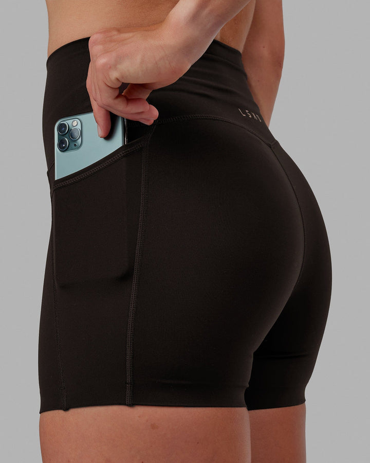 Woman wearing Elixir X-Short Tights With Pockets - Dark Walnut