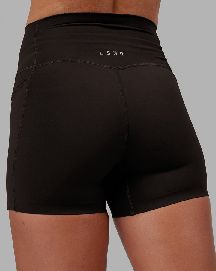 Woman wearing Elixir X-Short Tights With Pockets - Dark Walnut