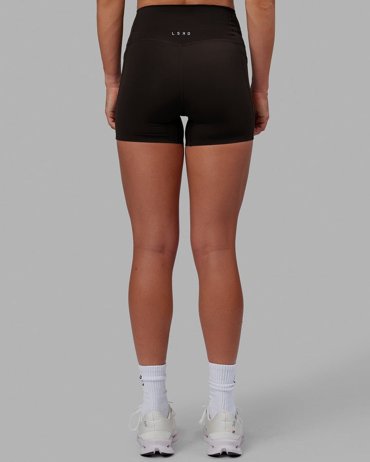 Woman wearing Elixir X-Short Tights With Pockets - Dark Walnut