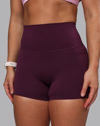 Woman wearing Elixir Ultra High-Rise 4" Short Pockets - Cherry Lacquer | Model:Lyss | Size:S