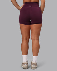 Woman wearing Elixir Ultra High-Rise 4" Short Pockets - Cherry Lacquer | Model:Lyss | Size:S