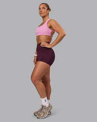 Woman wearing Elixir Ultra High-Rise 4" Short Pockets - Cherry Lacquer | Model:Lyss | Size:S