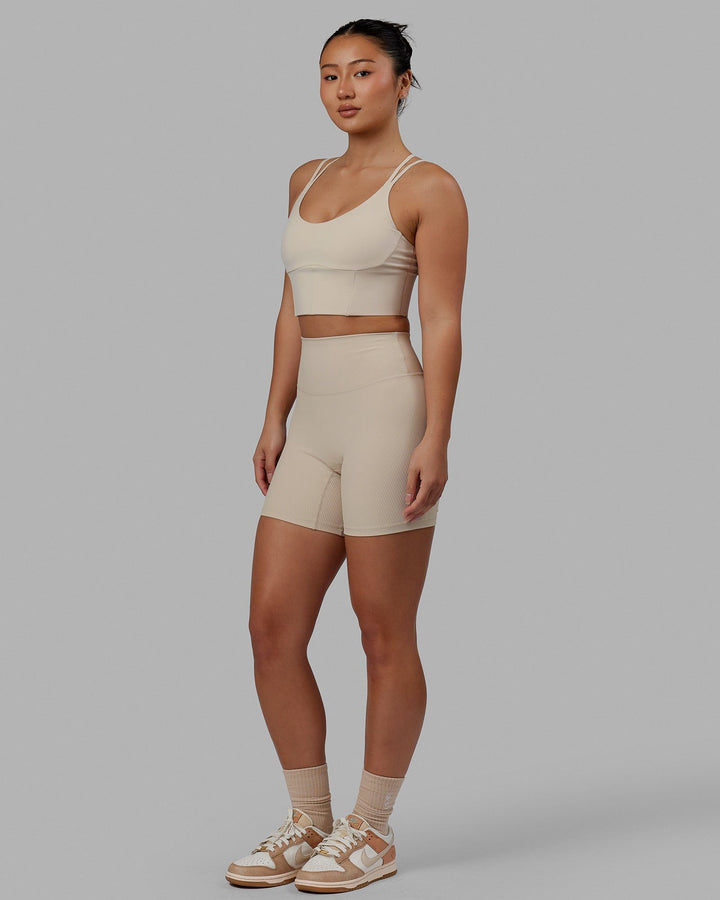 Woman wearing Empower Corset Bra - Shale Beige
