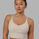 Woman wearing Empower Corset Bra - Shale Beige