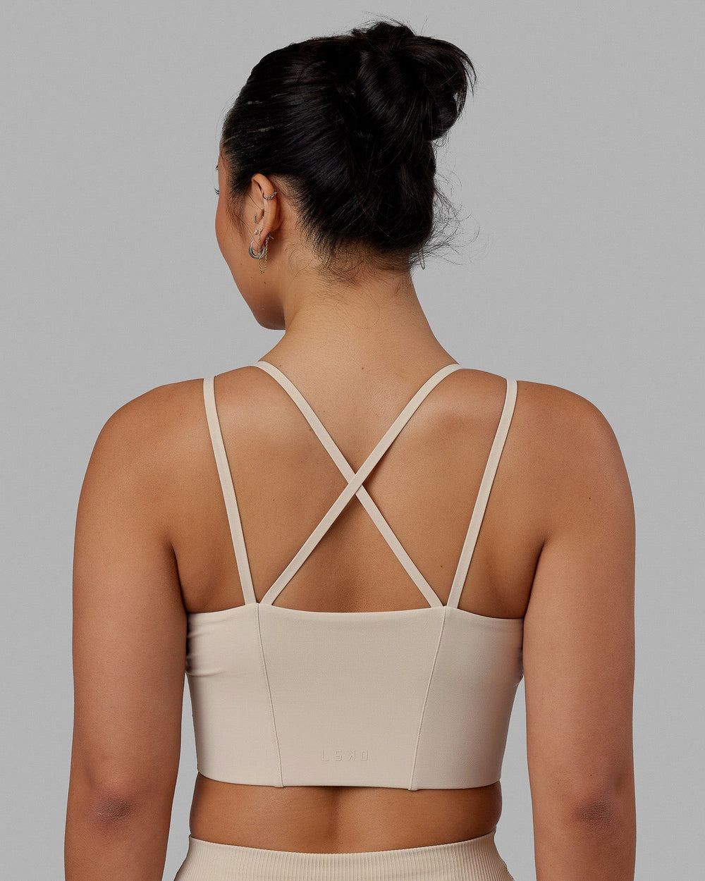 Woman wearing Empower Corset Bra - Shale Beige