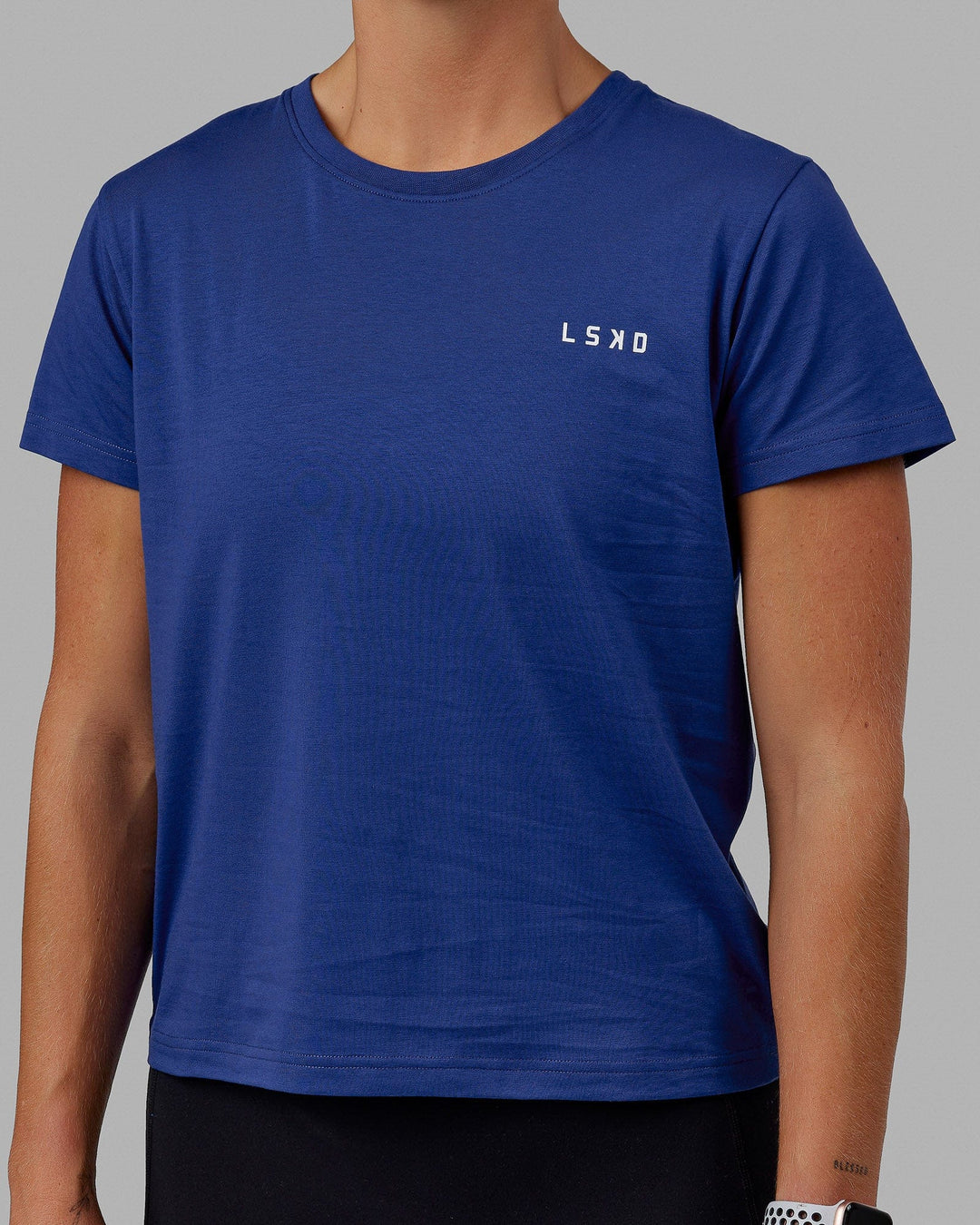 Woman wearing Endeavour FLX Cotton Tee - Galactic Cobalt-White