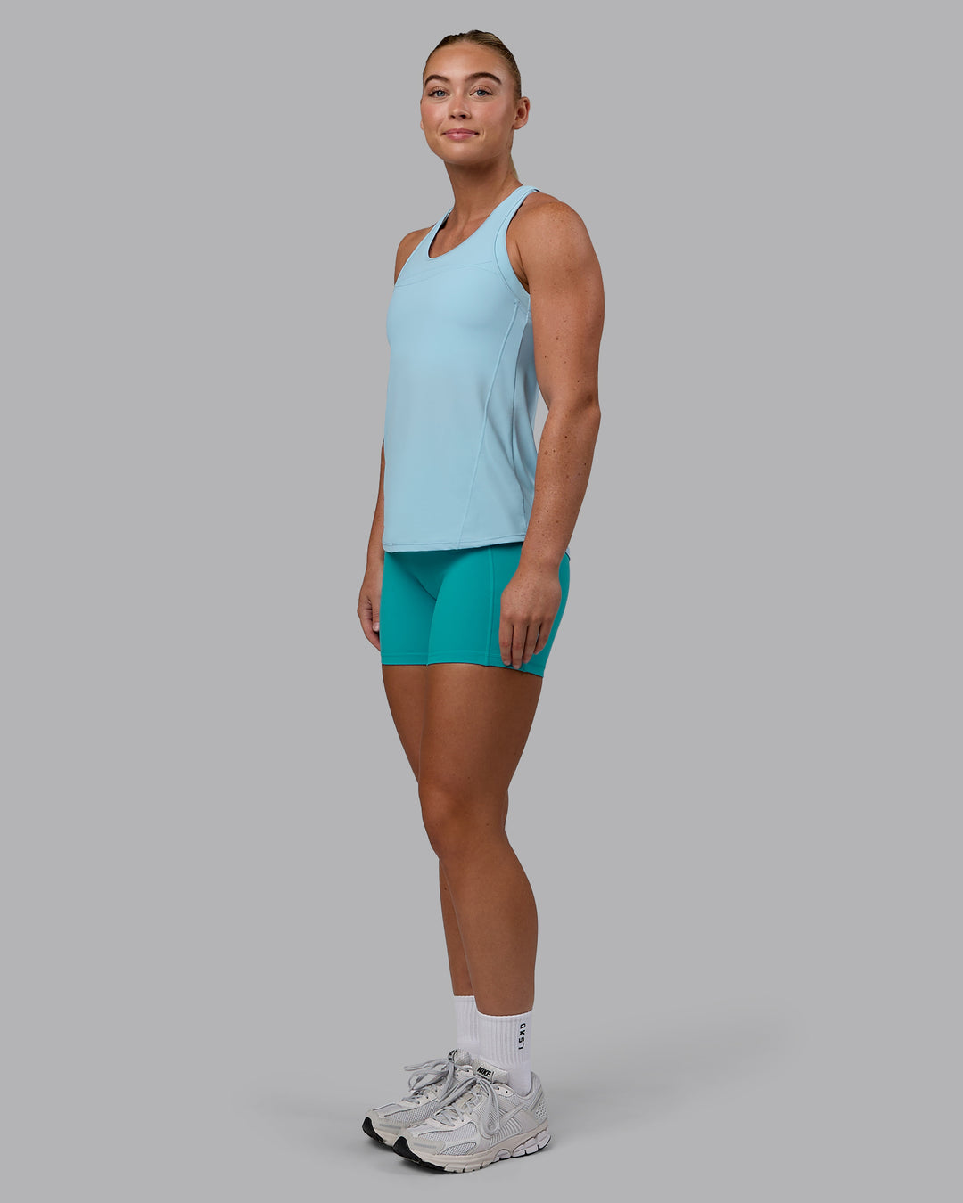 Woman wearing Endorphin Rush Tank - Glacial Blue